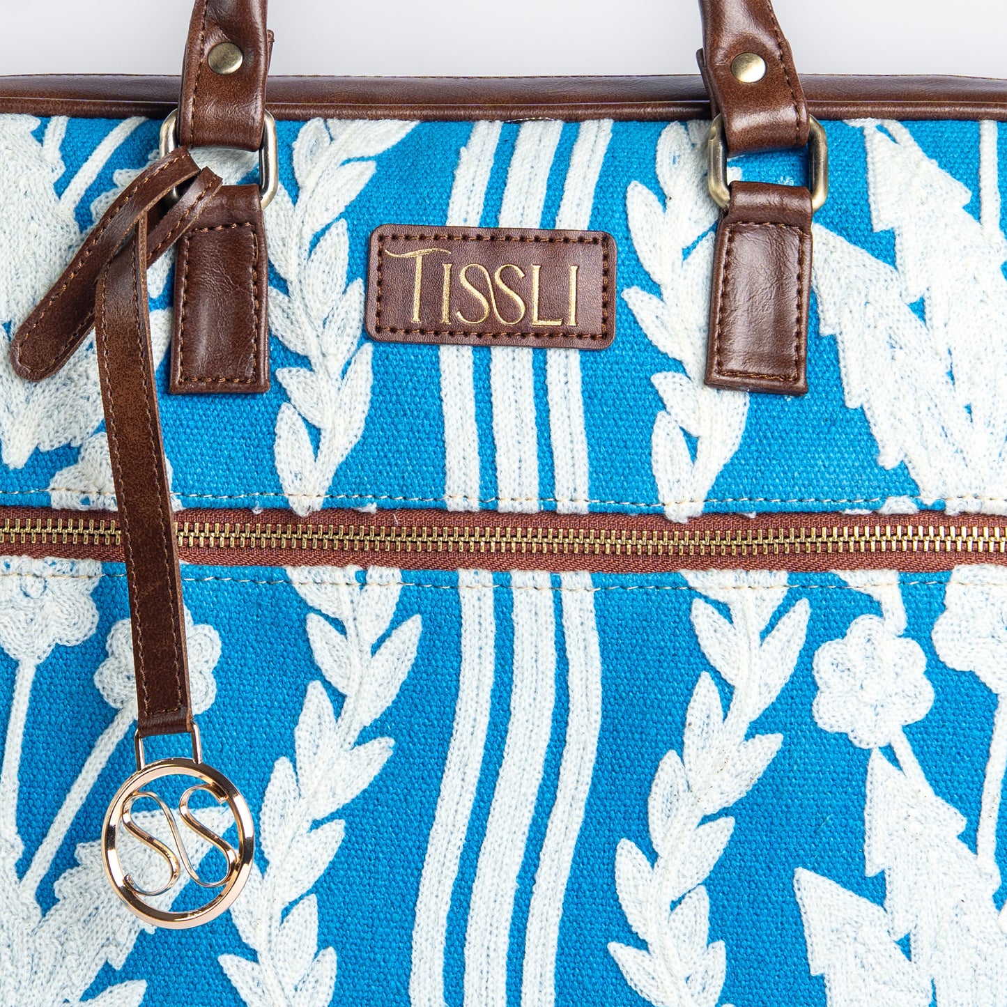 Chikankari Bloom Laptop Bag | White floral embroidery on blue base, handcrafted for timeless charm