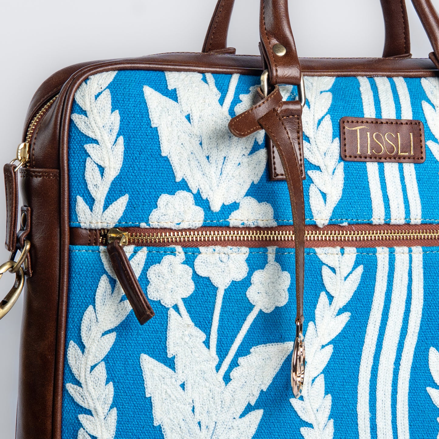Chikankari Bloom Laptop Bag | White floral embroidery on blue base, handcrafted for timeless charm