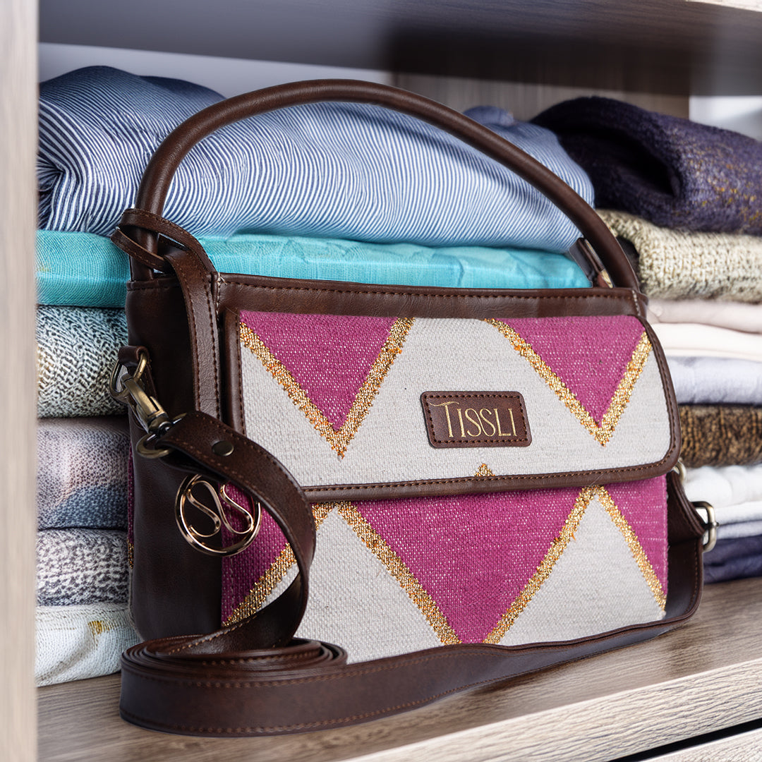 Fuchsia Fusion Hand Bag | Handwoven pink and white geometric design with golden accents for a vibrant look