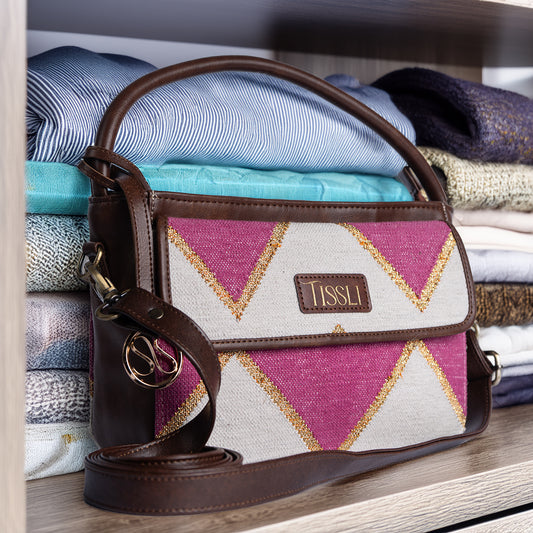 Fuchsia Fusion Hand Bag | Handwoven pink and white geometric design with golden accents for a vibrant look