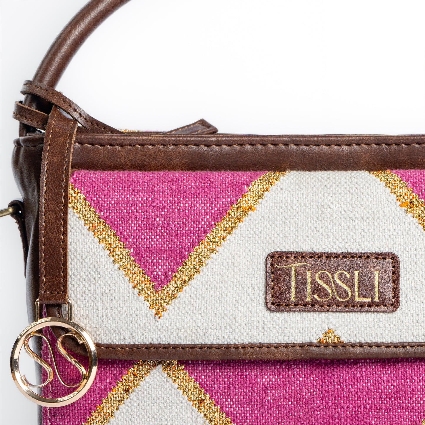 Fuchsia Fusion Hand Bag | Handwoven pink and white geometric design with golden accents for a vibrant look