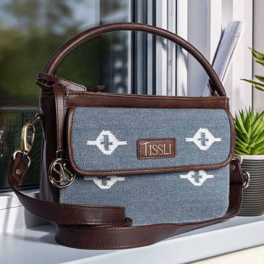 Skylight Serenity Cross Body Bag | Handwoven blue fabric with white motifs for a clean, timeless look