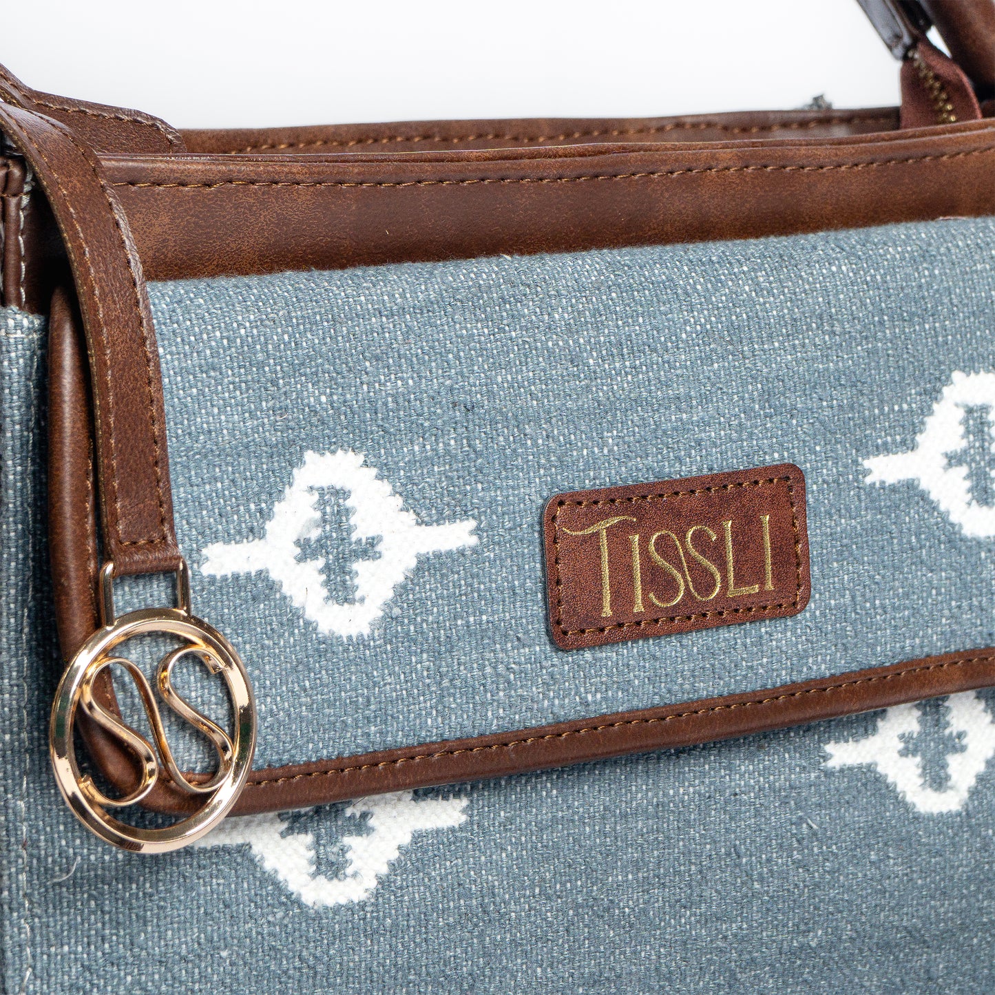 Skylight Serenity Cross Body Bag | Handwoven blue fabric with white motifs for a clean, timeless look