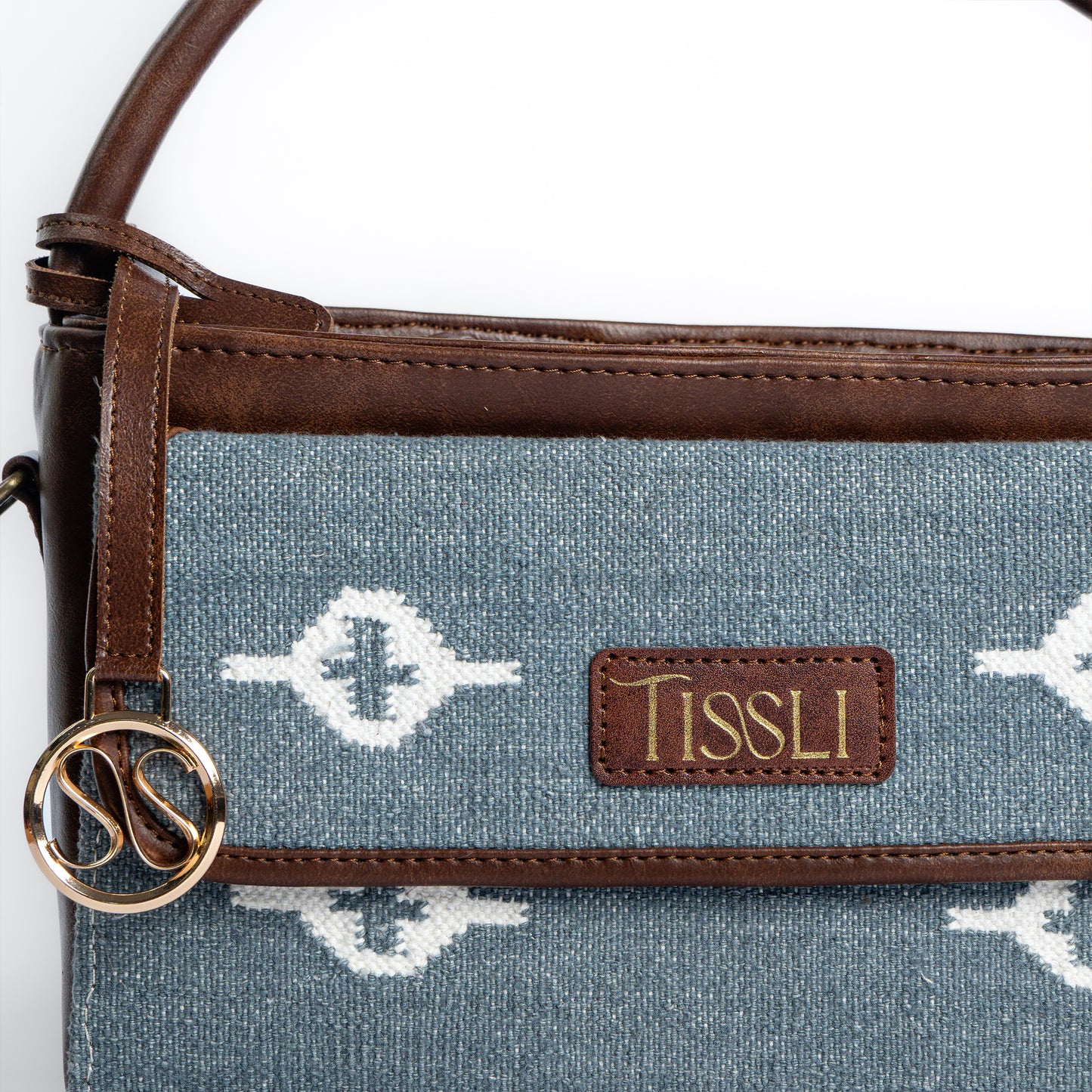 Skylight Serenity Cross Body Bag | Handwoven blue fabric with white motifs for a clean, timeless look