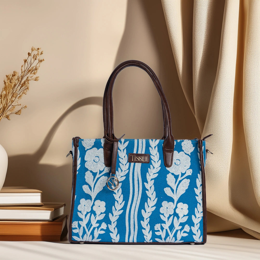 Chikankari Grace Tote Bag | Elegant handcrafted tote with white floral embroidery on a blue base