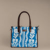 Chikankari Grace Tote Bag | Elegant handcrafted tote with white floral embroidery on a blue base