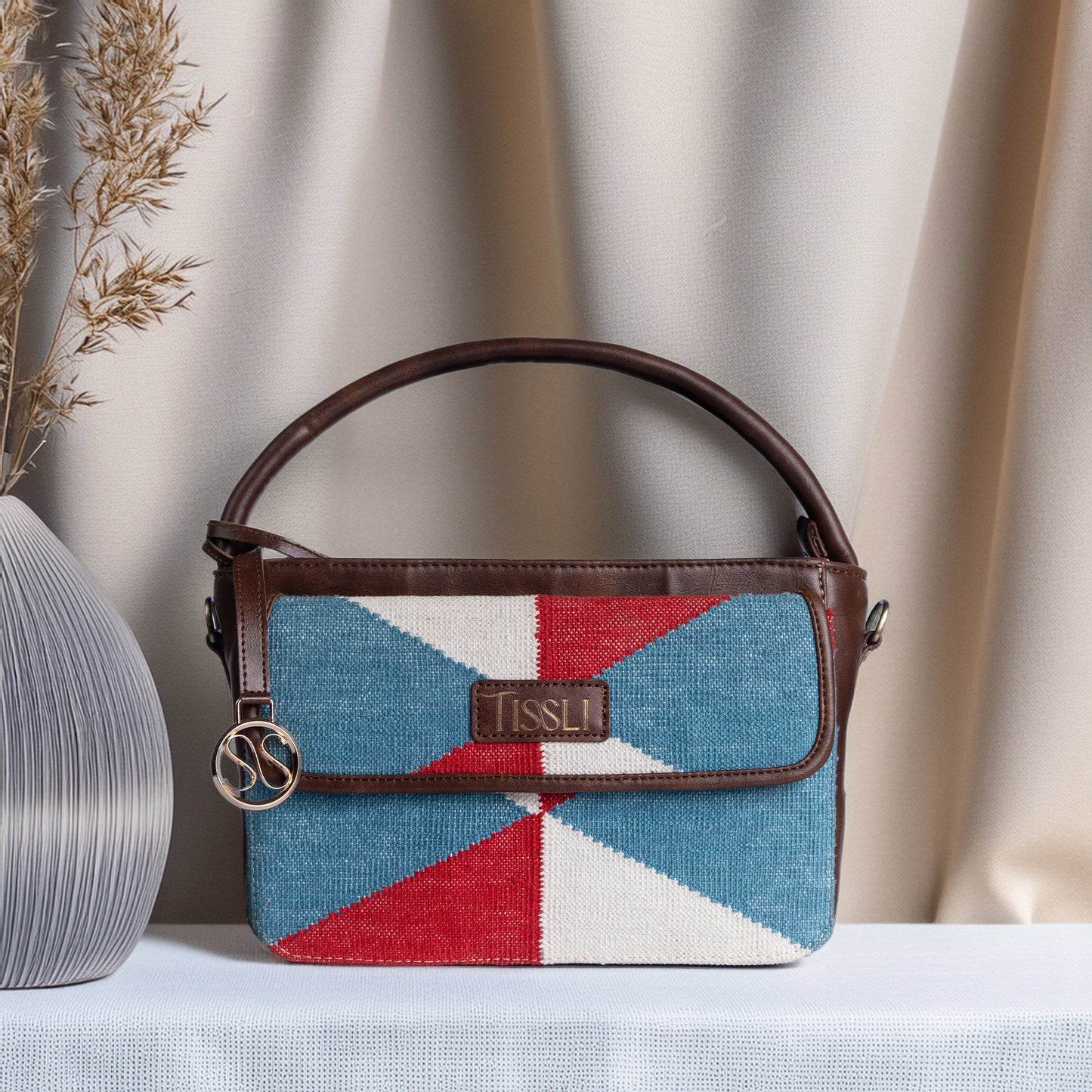 Illusionist Tri-Color Pattern Sling Bag with Brown Leather Detailing | Handwoven Compact Shoulder Bag