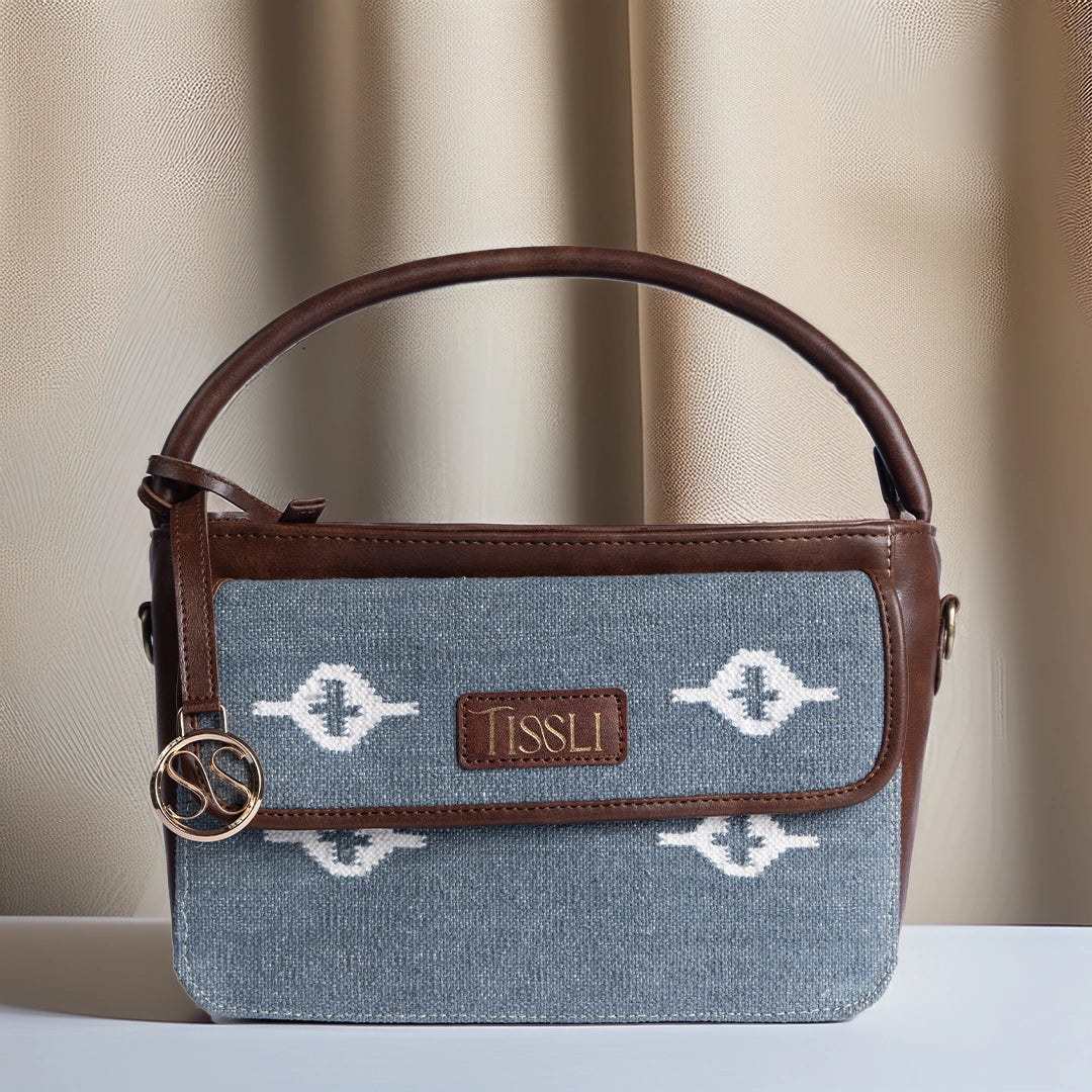Skylight Serenity Cross Body Bag | Handwoven blue fabric with white motifs for a clean, timeless look