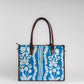 Chikankari Grace Tote Bag | Elegant handcrafted tote with white floral embroidery on a blue base