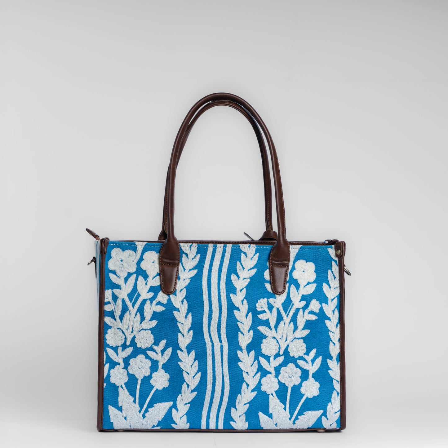Chikankari Grace Tote Bag | Elegant handcrafted tote with white floral embroidery on a blue base