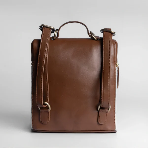 Tissli indigo and brown handwoven tribal backpack with adjustable straps and secure back pocket.