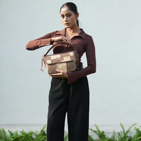 Interior view of Tissli checkers grid handwoven sling bag showing three internal pocket organizers and water-resistant lining.
