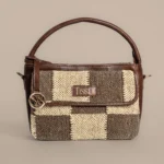Tissli handwoven checkerboard rug sling bag with brown and cream "Cotton Panja" weave and leather handle.