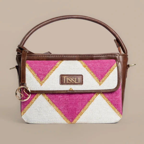 Tissli handwoven pink and white geometric rug handbag with gold lurex accents and premium brown leather handle.