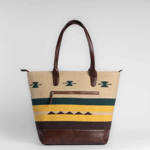 Tissli mustard yellow and forest green handwoven rug tote with deep brown tribal motifs and leather straps.