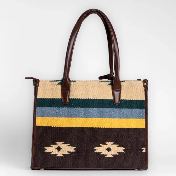Tissli unisex tribal-stripe handwoven rug tote with forest green, mustard, and cream patterns.
